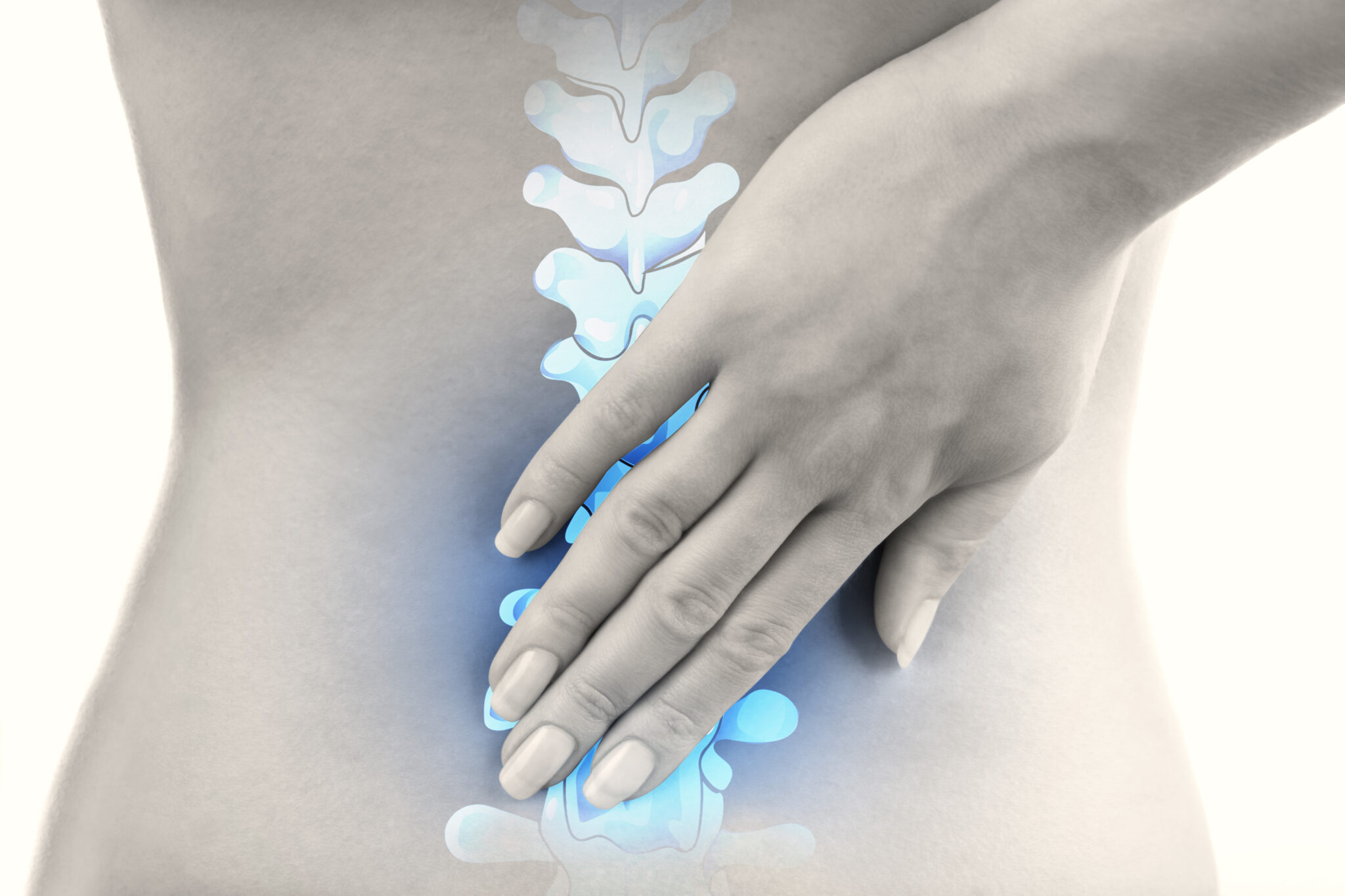 Image of woman rubbing lower back